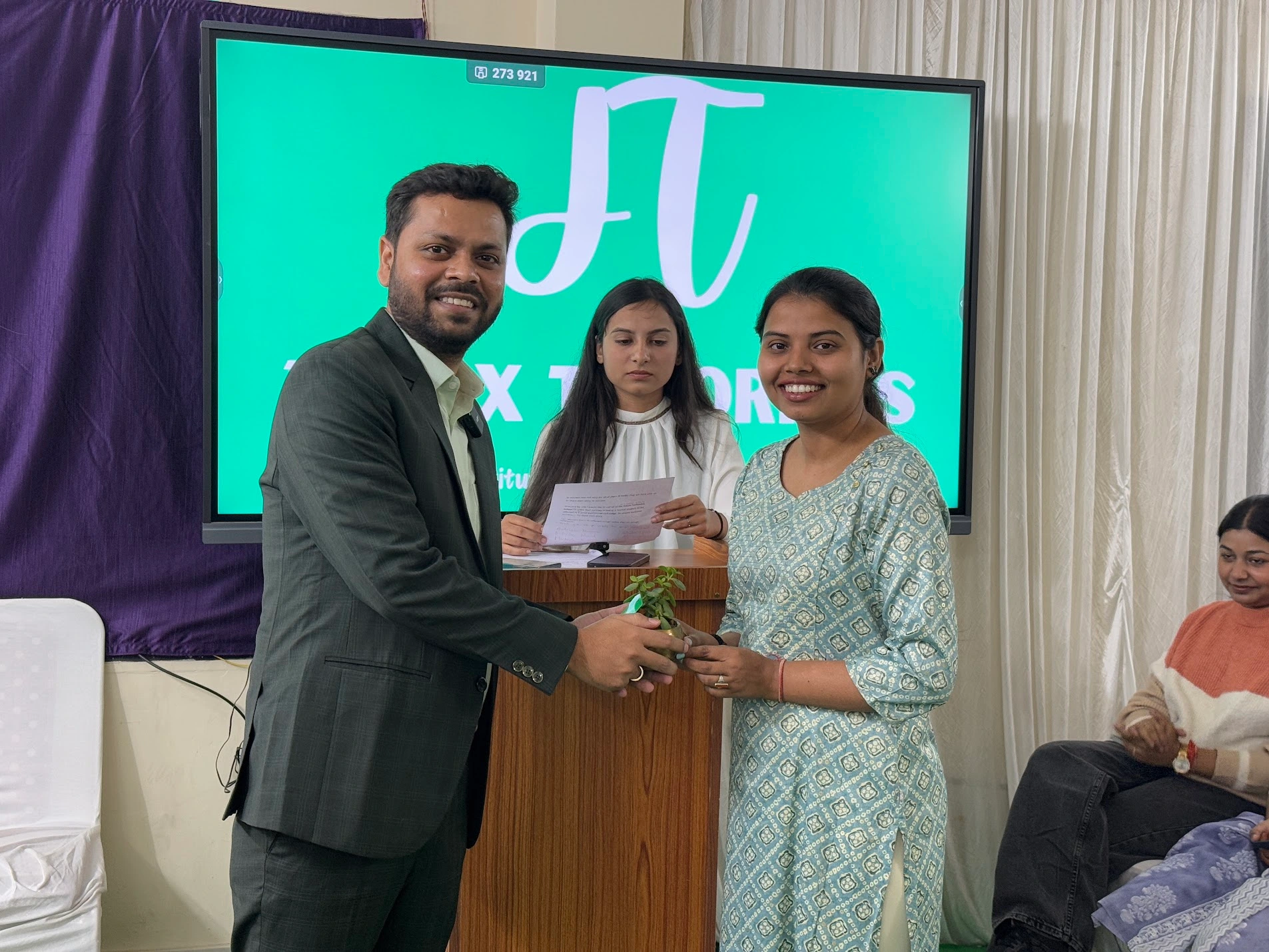 Student receiving recognition during an academic event at Judex Tutorials Patna